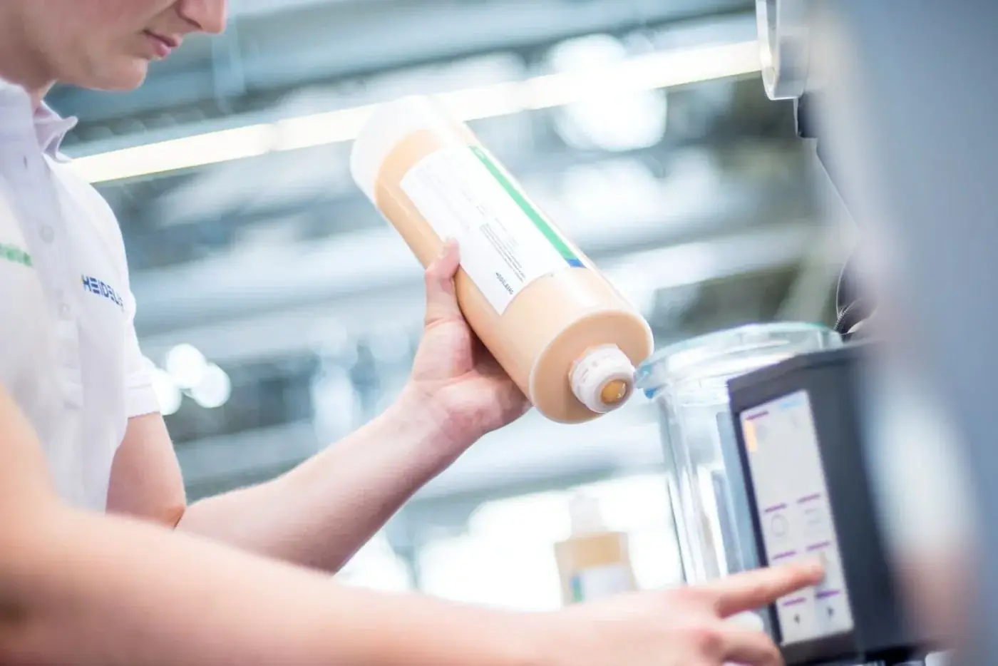 Intergraph technician handling pressroom ink and chemistry