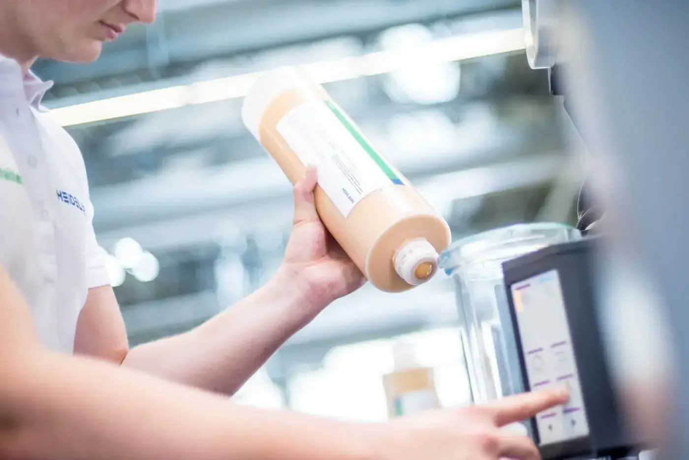 Intergraph technician handling pressroom ink and chemistry