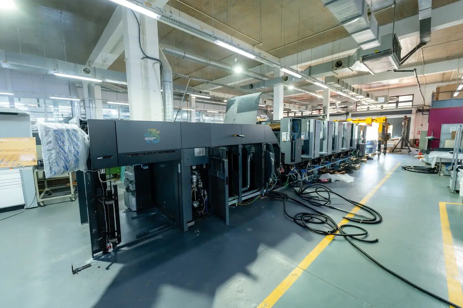 A Heidelberg Speedmaster CX 104 press line during installation