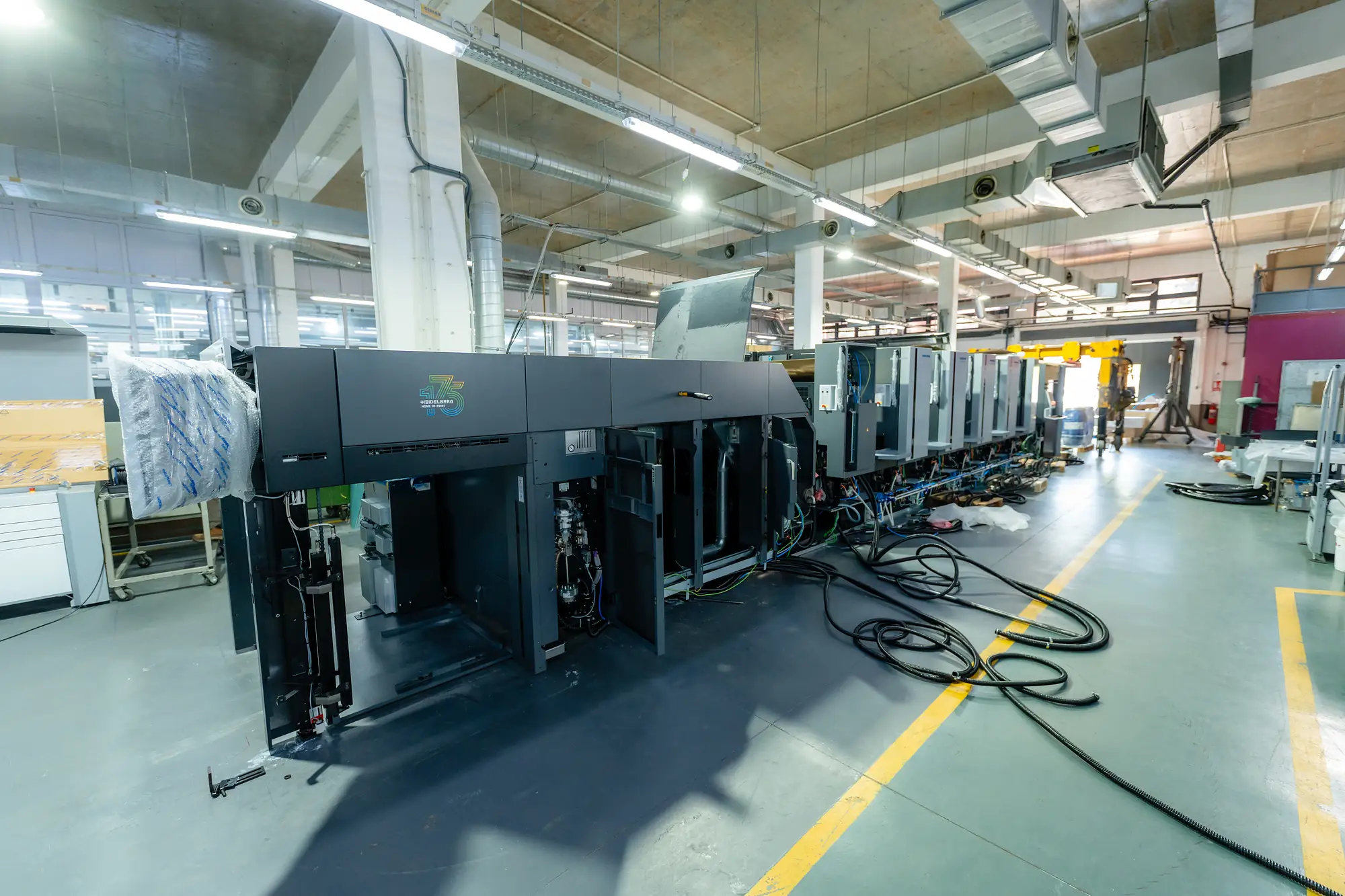 A Heidelberg Speedmaster CX 104 press line during installation