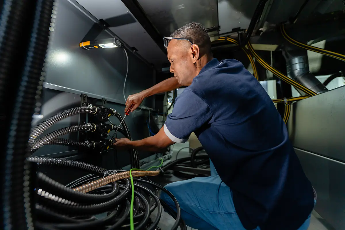 Intergraph technician working inside a Heidelberg Speedmaster
